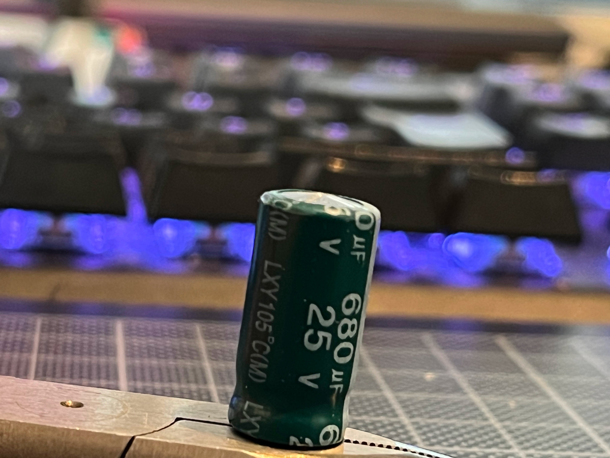 Faulty capacitor lifted cap